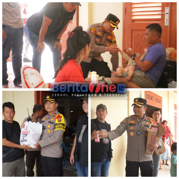 Polres Inhu Bawa Pesan Pemilu dan Susu ke Lokasi Pengungsian Banjir